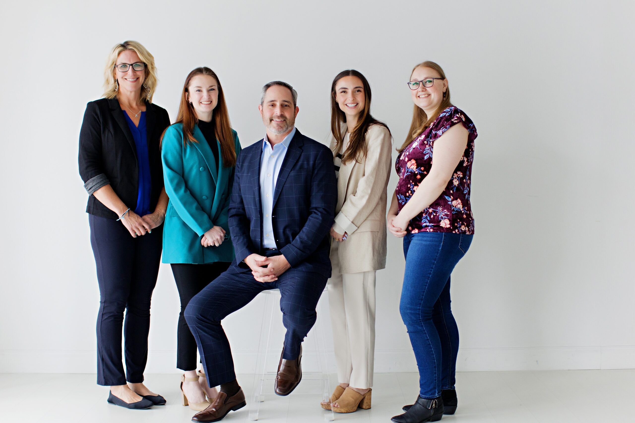 BAA's Atlanta team poses for an office photo. Five individuals in business casual attire, against a white background.