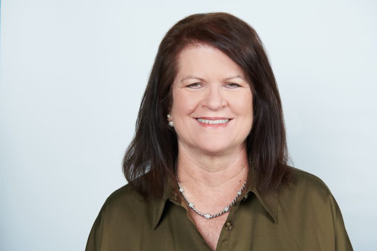 Photo of Susie Krajsa in a dark green blouse